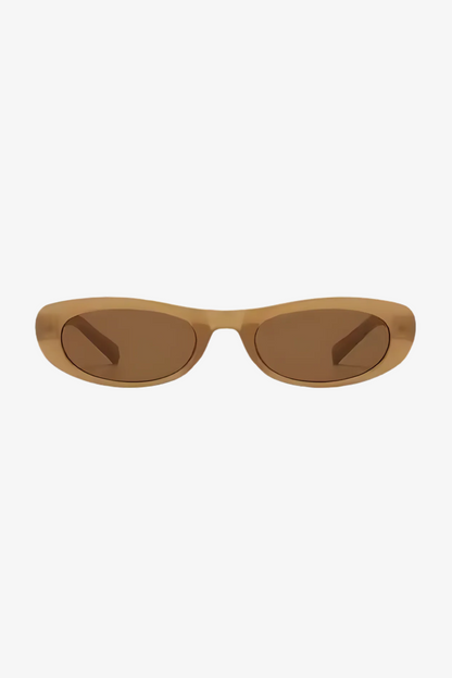 Sunglasses with a brown frame and light brown lenses on a white background