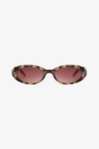 Sunglasses with tortoiseshell frame and pink lenses on a white background