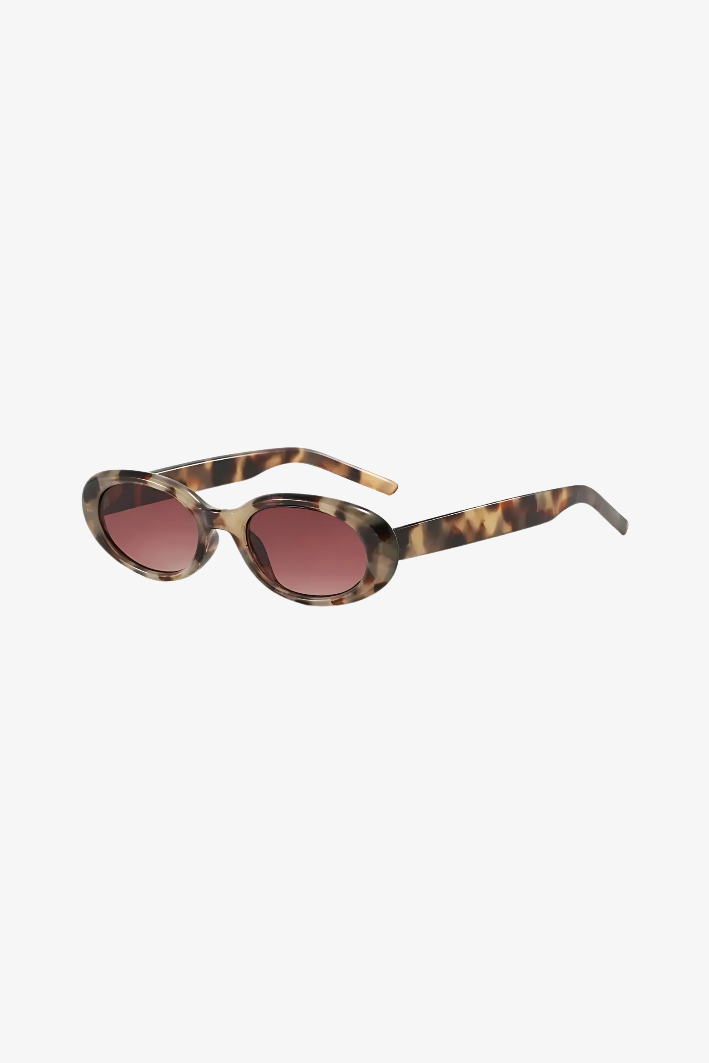 Tortoiseshell sunglasses with tinted lenses on a white background
