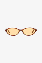 Sunglasses with brown frame and yellow-tinted lenses on a white background